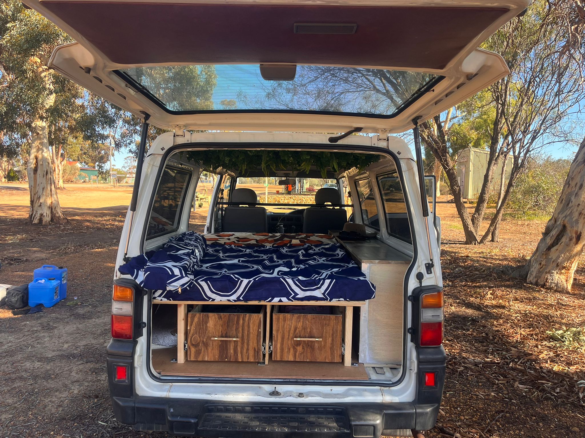 Amber — Mitsubishi Express van, rear interior with bed setup